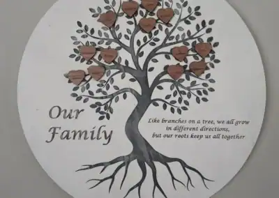 Custom laser-engraved family tree wood sign with heartfelt message.