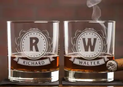 Custom engraved whiskey glasses with initials "R" and "W" and names Richard and Walter.