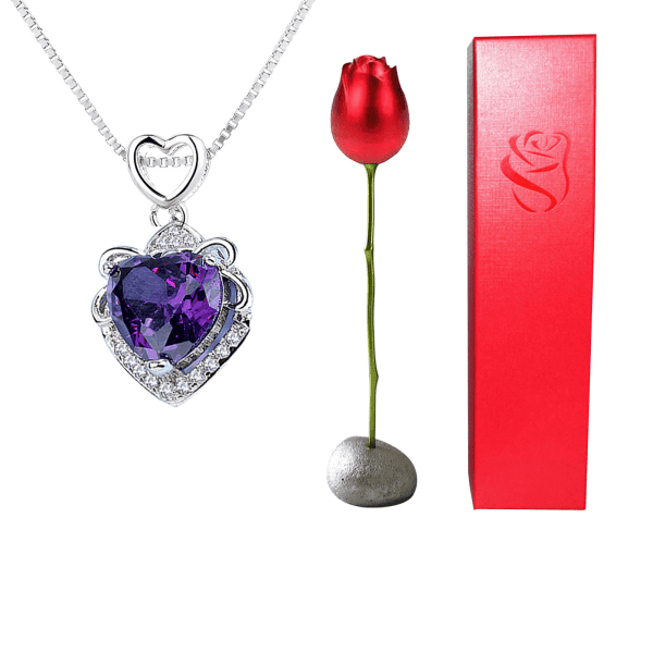 Elegant silver heart necklace with purple gemstone and diamond accents. Perfect for special occasions and gifts.