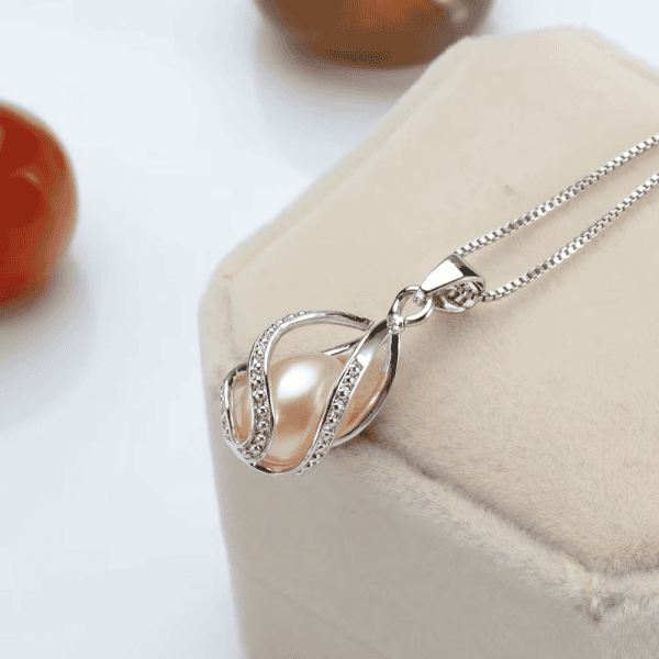 Sterling silver necklace with a freshwater pearl and embedded crystals, perfect for special occasions.