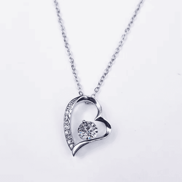 Elegant silver heart necklace with sparkling crystal centerpiece, perfect for special occasions or everyday wear.
