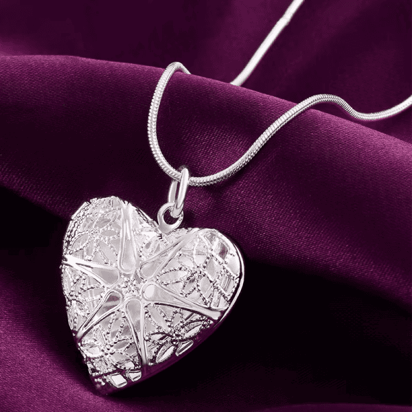 Silver heart-shaped photo frame pendant on necklace, personalized keepsake jewelry.