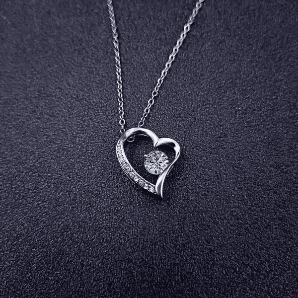 Elegant heart pendant necklace featuring cubic zirconia, perfect for women’s jewelry collection.
