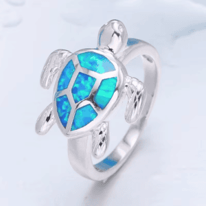 Colorful turtle ring with inlaid opal shell design, sterling silver jewelry piece.