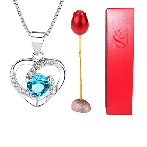 Stunning heart-shaped silver pendant with blue gemstone and sparkling accents, perfect for custom jewelry design.