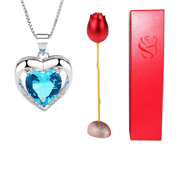 Sparkling silver heart necklace with blue crystal, romantic rose and stylish red gift box for special occasions.