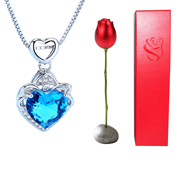 Elegant silver heart-shaped pendant with blue gemstone, ideal for custom engraved jewelry.