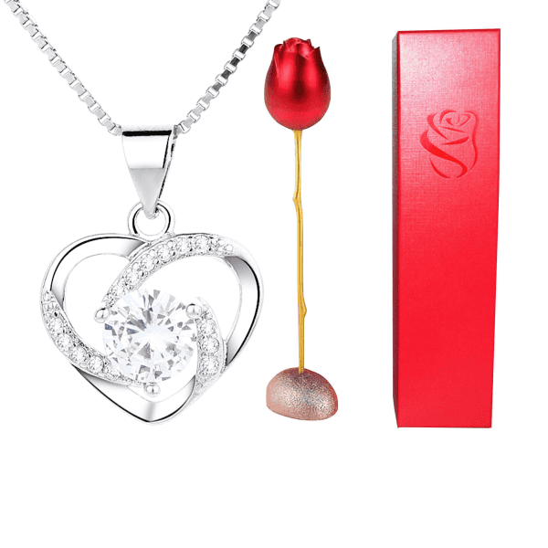 Luxurious silver heart pendant with sparkling cubic zirconia stones, perfect for gifts.